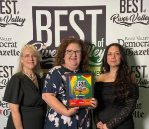 Three KC Tutoring team members holding the Best of the River Valley 2026 Winner plaque for Learning / Tutor Center